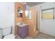 A full bathroom with tile walls, vanity, and toilet at 1144 7Th Nw St, Largo, FL 33770