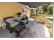 Cozy covered patio with comfortable seating, creating an inviting outdoor relaxation space with potential for an extension at 1144 7Th Nw St, Largo, FL 33770