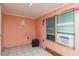 A cozy room with natural light, tiled floors, and neutral walls at 1144 7Th Nw St, Largo, FL 33770