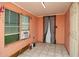 A cozy room with natural light, tiled floors, and neutral walls at 1144 7Th Nw St, Largo, FL 33770