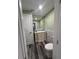 Cozy bathroom boasts a modern vanity, stylish marble backsplash, and wood-look flooring at 11889 Walker Ave, Seminole, FL 33772