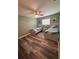 Bedroom with luxury vinyl floors, two beds, a ceiling fan and updated lighting at 11889 Walker Ave, Seminole, FL 33772