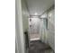 Shower features elegant marble tiling, a convenient built-in shelf, and pebble flooring at 11889 Walker Ave, Seminole, FL 33772