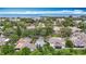 Stunning aerial shot showcasing a home near the ocean, close to local amenities and surrounded by trees and lush landscaping at 120 Colony South Dr, Tarpon Springs, FL 34689
