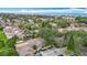 An aerial view showcasing a home in a residential area, close to the ocean with beautifully landscaped surroundings at 120 Colony South Dr, Tarpon Springs, FL 34689