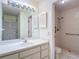 Bathroom featuring a single vanity, shower stall, and a view of the closet at 120 Colony South Dr, Tarpon Springs, FL 34689