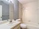 Clean bathroom featuring tub, shower, and sink with vanity, designed for comfort and convenience at 120 Colony South Dr, Tarpon Springs, FL 34689