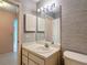 A well-lit bathroom with a vanity, sink, and mirror, providing a functional and pleasant space at 120 Colony South Dr, Tarpon Springs, FL 34689