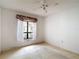 Bedroom featuring a bright window view, creating a serene and comfortable living space at 120 Colony South Dr, Tarpon Springs, FL 34689