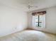 Bright bedroom with a window, offering a serene and comfortable living space at 120 Colony South Dr, Tarpon Springs, FL 34689
