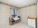 Dining area with large window and neutral decor at 120 Colony South Dr, Tarpon Springs, FL 34689
