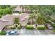 Charming home with well-maintained landscaping, a private courtyard entrance, and a convenient attached garage at 120 Colony South Dr, Tarpon Springs, FL 34689