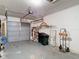 A well-lit two car garage features an automatic garage door, and space for parking and storage at 120 Colony South Dr, Tarpon Springs, FL 34689