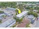 Aerial view of a multifamily property complex surrounded by lush greenery at 1221 Drew St # E12, Clearwater, FL 33755