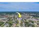 An aerial view of the property surrounded by lush trees and a residential neighborhood at 1221 Drew St # E12, Clearwater, FL 33755