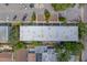 Birds-eye-view of a multifamily property complex featuring mature trees and greenery at 1221 Drew St # E12, Clearwater, FL 33755