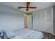 Bedroom with a comfortable bed, ceiling fan, and closet with paneled doors at 1221 Drew St # E12, Clearwater, FL 33755