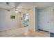 Dining area featuring neutral tile flooring, ceiling fan and doorway to kitchen and entrance at 1221 Drew St # E12, Clearwater, FL 33755