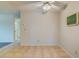 Dining space featuring neutral tile flooring, ceiling fan and doorway to hall and bedrooms at 1221 Drew St # E12, Clearwater, FL 33755