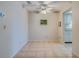 Open-concept dining area boasting neutral tile flooring and a ceiling fan at 1221 Drew St # E12, Clearwater, FL 33755