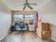 Bright room featuring a ceiling fan, computer desk, and natural light from the window at 1221 Drew St # E12, Clearwater, FL 33755