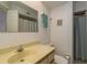 Bathroom featuring a vanity, toilet, shower, and large mirror at 1241 S Martin Luther King Jr Ave # 302, Clearwater, FL 33756
