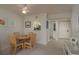 Dining room with table and pass-through to kitchen at 1241 S Martin Luther King Jr Ave # 302, Clearwater, FL 33756