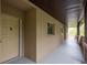 Exterior side view of a condo with a long porch and railing at 1241 S Martin Luther King Jr Ave # 302, Clearwater, FL 33756