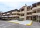 Exterior shot of a condo building featuring parking and walkways with clean landscaping at 1241 S Martin Luther King Jr Ave # 302, Clearwater, FL 33756