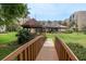 Community grounds featuring a charming gazebo, bridge, lush greenery, and walking paths at 1241 S Martin Luther King Jr Ave # 302, Clearwater, FL 33756