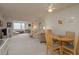 Bright living room with ceiling fan and neutral carpet with a floral couch at 1241 S Martin Luther King Jr Ave # 302, Clearwater, FL 33756