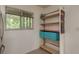 Open pantry shelving for extra storage by the window at 1241 S Martin Luther King Jr Ave # 302, Clearwater, FL 33756