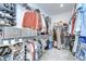 Walk-in closet with ample shelving and hanging space for clothes and accessories at 12902 Brookside Moss Dr, Riverview, FL 33579