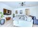 Comfortable living room featuring a large sectional sofa, entertainment center, and stylish decor at 12902 Brookside Moss Dr, Riverview, FL 33579