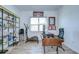 Bright office space with wood flooring, natural light, shelving and desk area at 12902 Brookside Moss Dr, Riverview, FL 33579
