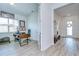 Open concept office with wood floors, natural light, desk, chair and exercise equipment at 12902 Brookside Moss Dr, Riverview, FL 33579