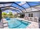 Screened-in pool with spa and outdoor bar with view of the house at 12902 Brookside Moss Dr, Riverview, FL 33579