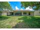 The home features a screened patio and a nice backyard at 13819 Stoneridge Dr, Hudson, FL 34669