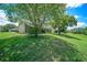 The home features a large backyard surrounded by big trees at 13819 Stoneridge Dr, Hudson, FL 34669