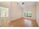 Bright bedroom boasts vaulted ceilings, wood floors, and a sun-filled window at 13819 Stoneridge Dr, Hudson, FL 34669