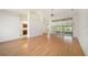 Bright living room with a wall of windows, wood floors and neutral paint at 13819 Stoneridge Dr, Hudson, FL 34669