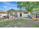 Exterior shot of house with a large backyard at 1505 E 99Th Ave, Tampa, FL 33612