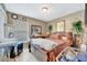 This is a bedroom with wood flooring and a dresser at 1505 E 99Th Ave, Tampa, FL 33612