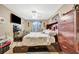 Comfortable bedroom offers natural light, storage under bed and an dark wood dresser at 1505 E 99Th Ave, Tampa, FL 33612
