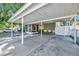 Attached car port area leading to a screened porch and a fenced area at 1505 E 99Th Ave, Tampa, FL 33612