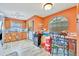 Open kitchen with updated appliances and a cozy breakfast nook with bright walls at 1505 E 99Th Ave, Tampa, FL 33612