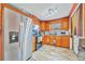 Functional kitchen with updated appliances, wood cabinets, and great lighting at 1505 E 99Th Ave, Tampa, FL 33612