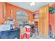 Bright breakfast nook in kitchen with a large window and colorful walls at 1505 E 99Th Ave, Tampa, FL 33612
