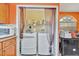 A view of the laundry room with both a washer and dryer at 1505 E 99Th Ave, Tampa, FL 33612
