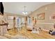 Spacious living room features light wood floors, warm paint, and a charming fireplace at 1505 E 99Th Ave, Tampa, FL 33612